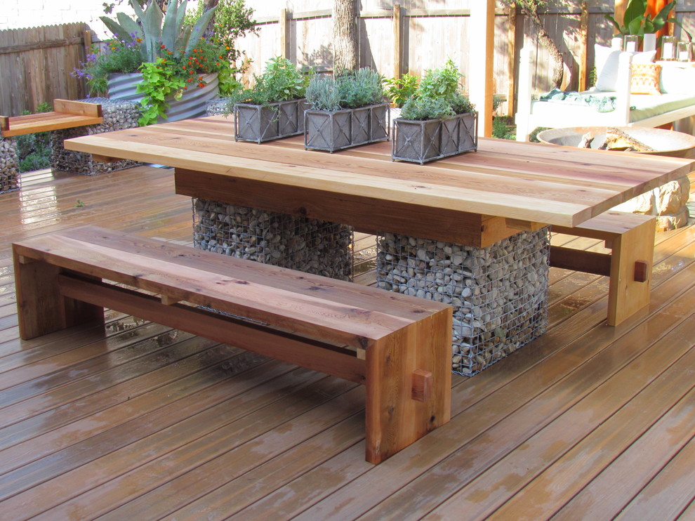 Example of a large minimalist backyard patio design in Austin with decking, a fire pit and a pergola