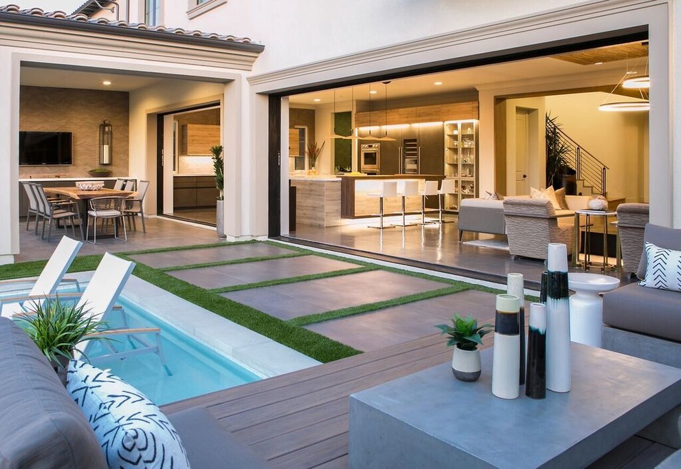 Inspiration for a mid-sized contemporary backyard concrete patio remodel in Orange County with no cover