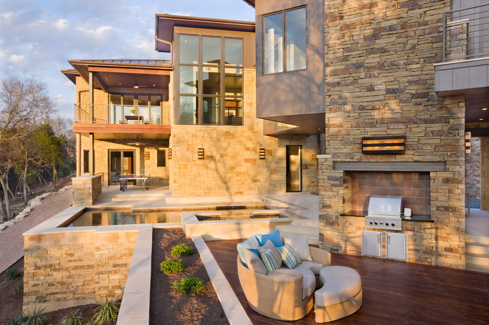 This is an example of a contemporary patio in Austin with a fire feature.