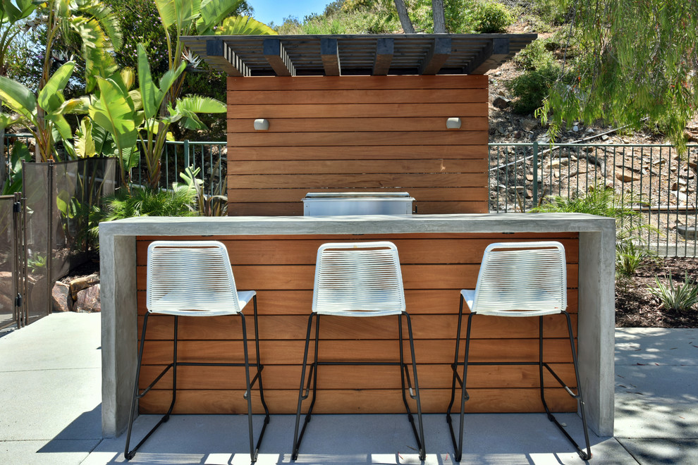 Inspiration for a contemporary back patio in San Diego with concrete slabs, a pergola and a bar area.