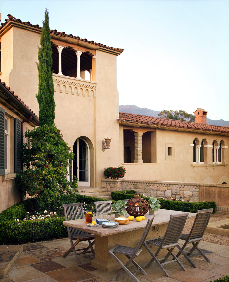 Design ideas for a mediterranean patio in San Francisco with natural stone paving and no cover.