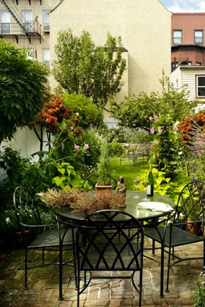 Patio - small traditional backyard brick patio idea in New York with no cover