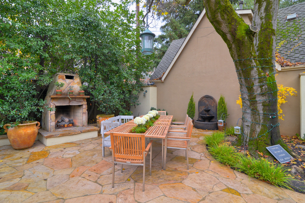 Inspiration for a timeless patio remodel in Sacramento with a fire pit