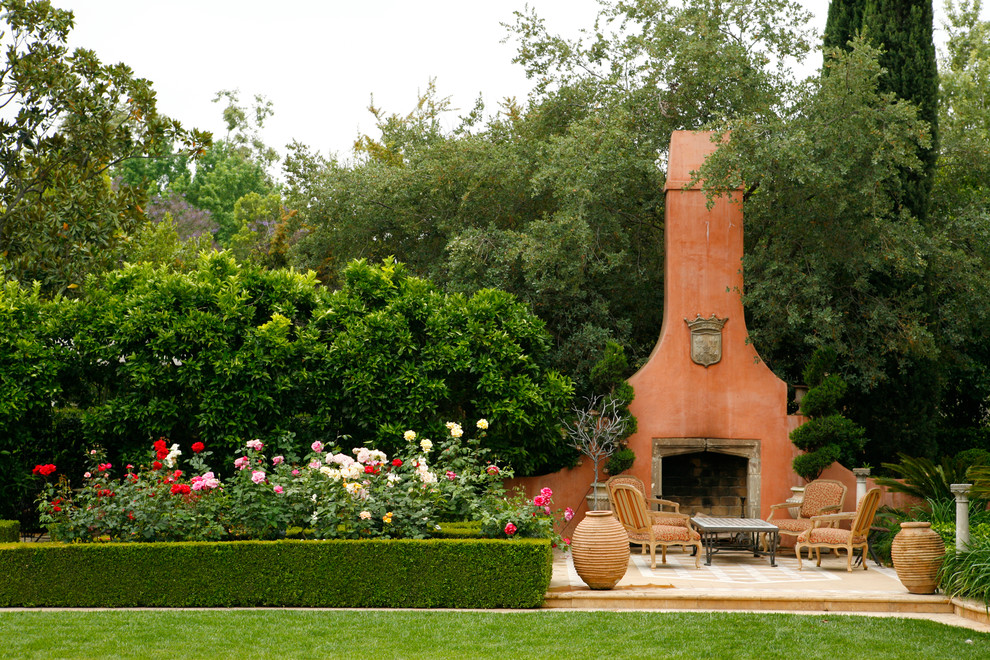 Patio - mediterranean patio idea in Los Angeles with a fire pit and no cover