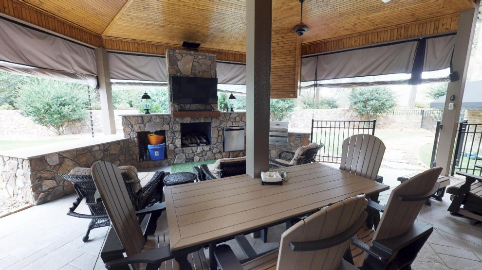 Exemple d'une terrasse arrière tendance avec une cuisine d'été et une extension de toiture.