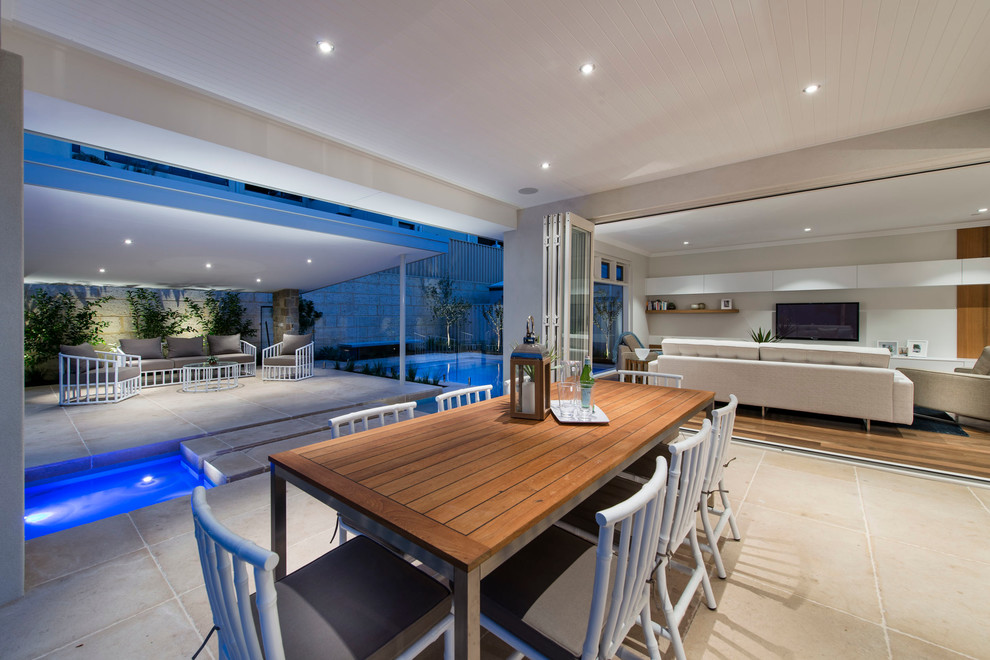 Contemporary patio in Perth with a water feature and a roof extension.