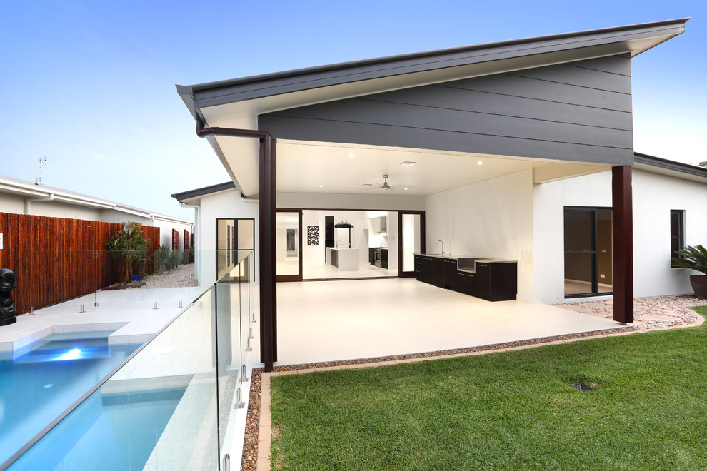 Medium sized modern back patio in Sunshine Coast with an outdoor kitchen, tiled flooring and a roof extension.