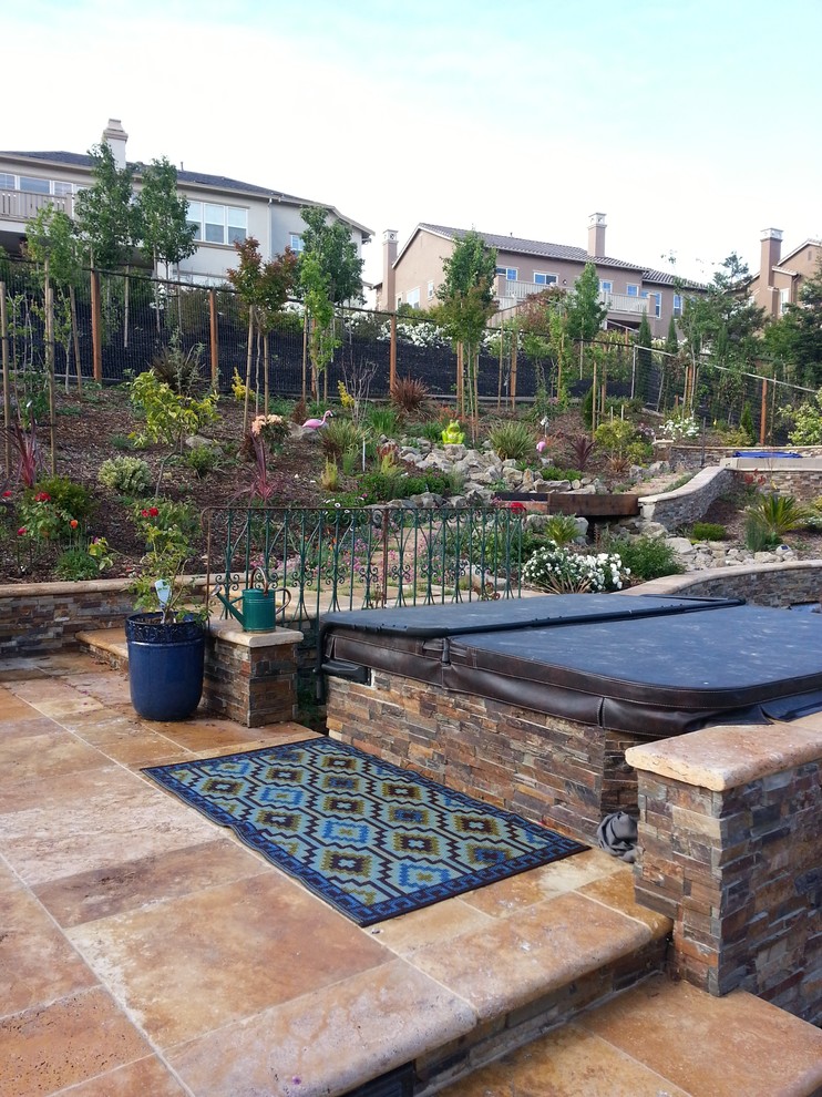 Inspiration for a medium sized back patio in San Francisco with natural stone paving and no cover.