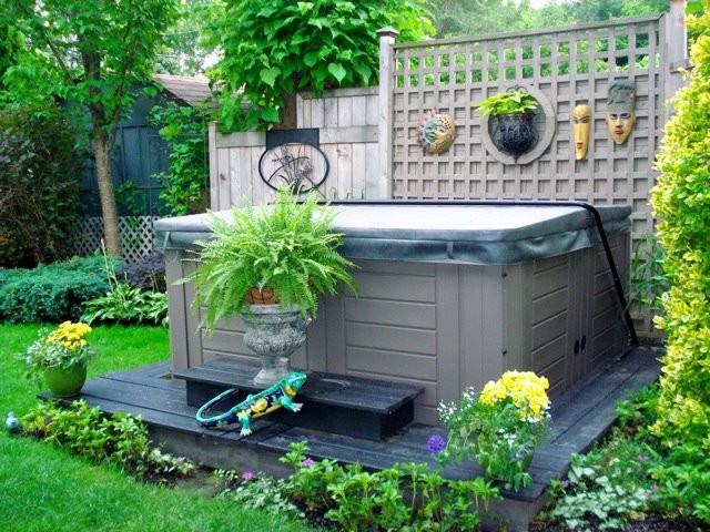 Example of a large classic backyard patio design in Toronto with decking
