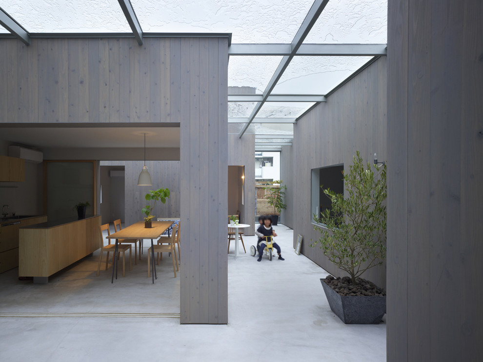 Patio kitchen - contemporary concrete patio kitchen idea in Other