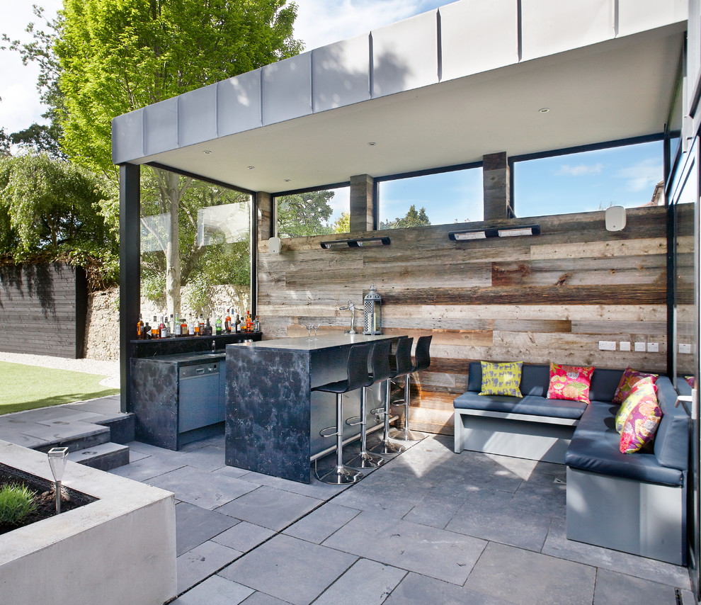 Photo of a contemporary patio in Dublin with a bar area.
