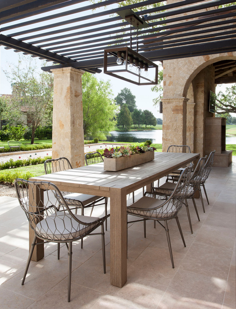 Photo of a mediterranean patio in Houston with a pergola.
