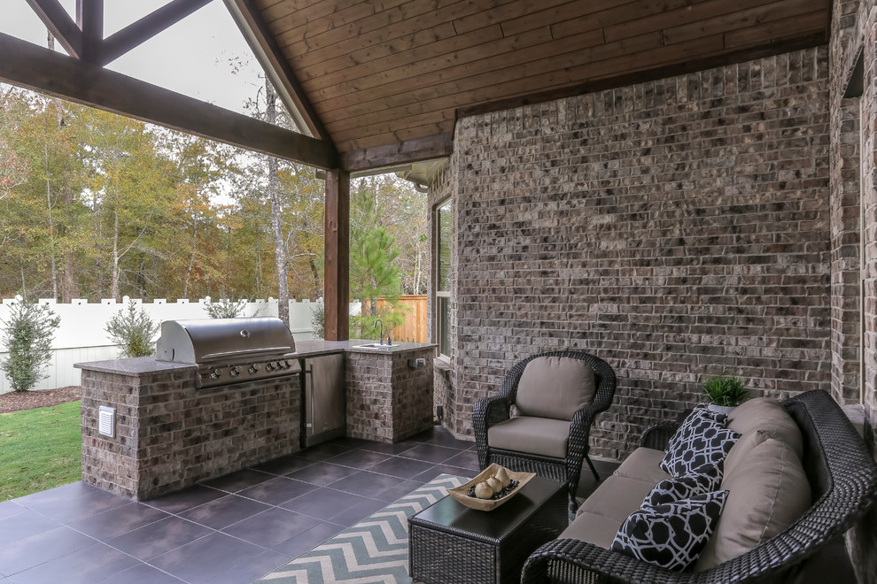 Large backyard tile patio kitchen photo in Dallas with a roof extension