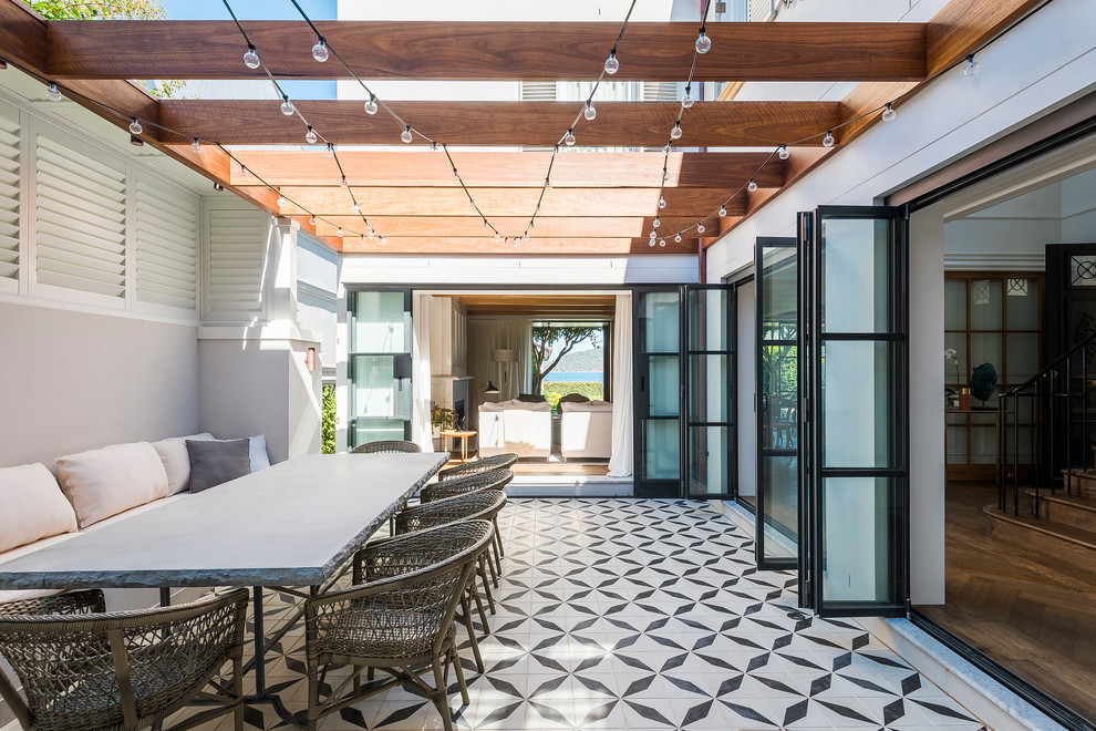 Design ideas for a contemporary patio in Sydney with a pergola.