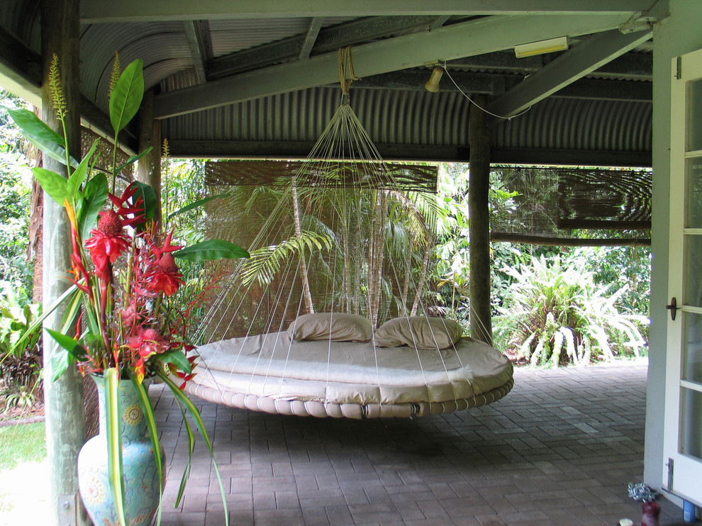 Inspiration for a tropical patio remodel in Other
