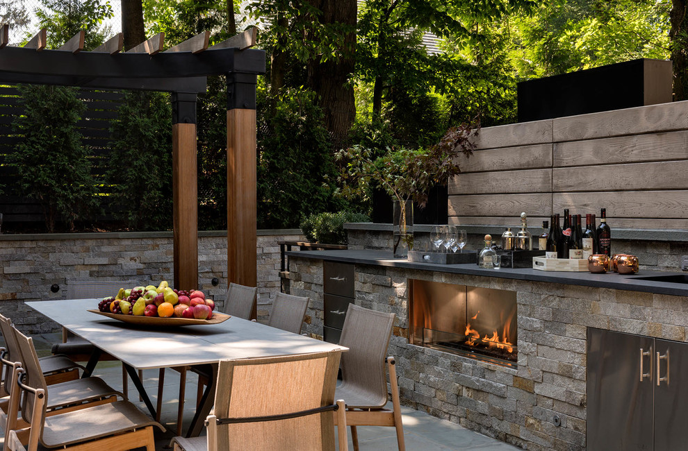 Design ideas for a classic patio in New York with a pergola and a bar area.