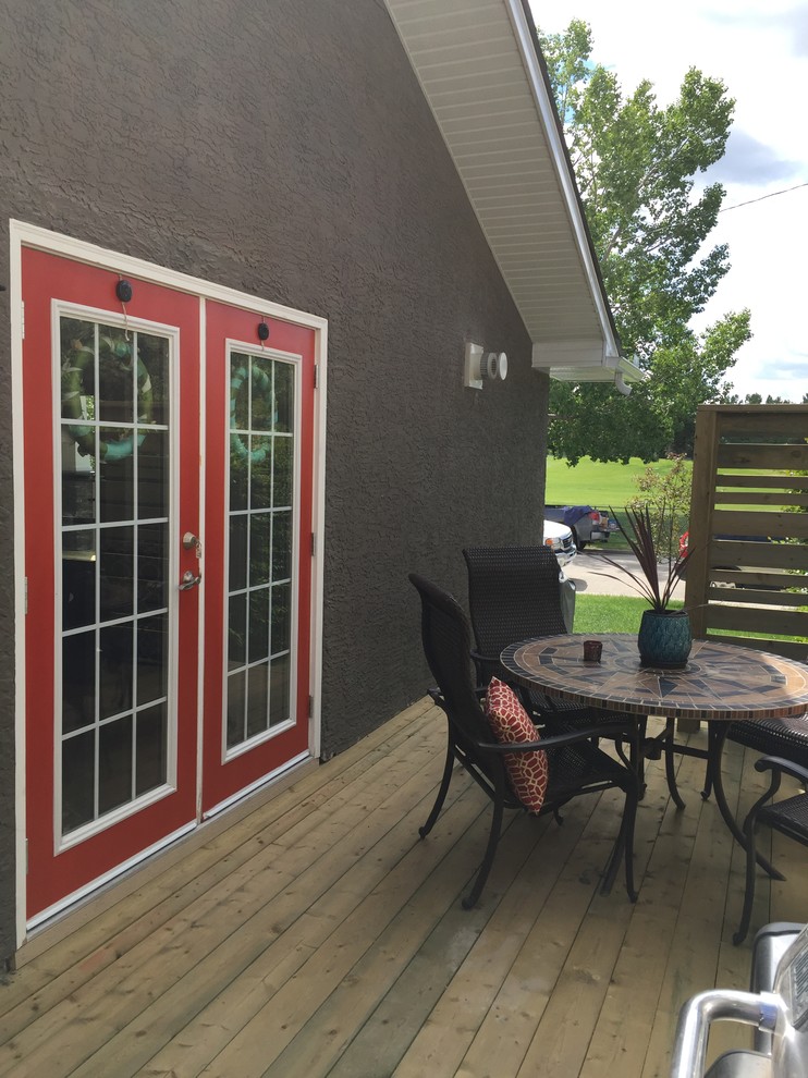 Photo of a medium sized classic back patio in Calgary with decking and no cover.