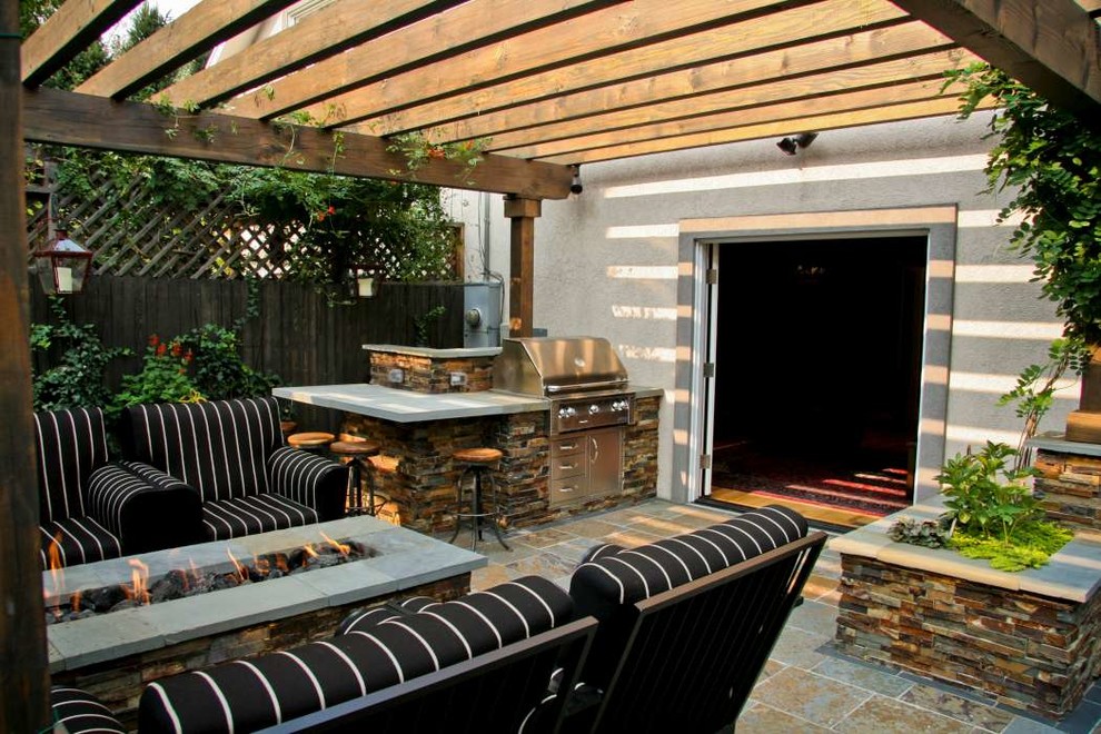 Inspiration for a small rustic back patio in Denver with an outdoor kitchen, tiled flooring and a pergola.