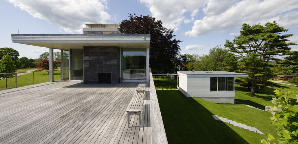 Inspiration for a contemporary patio in Boston with decking and no cover.