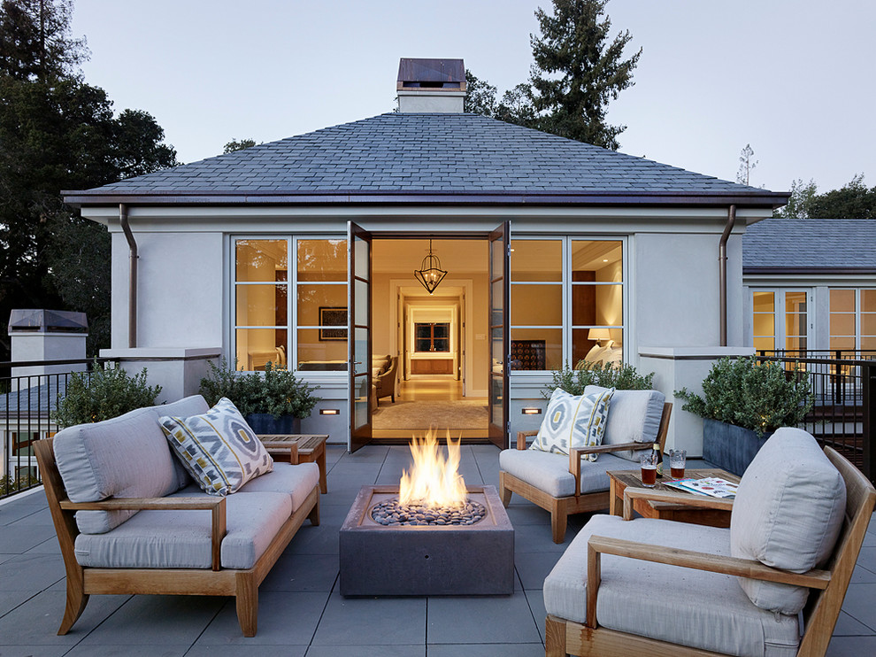 Patio - mid-sized contemporary backyard tile patio idea in San Francisco with no cover and a fire pit
