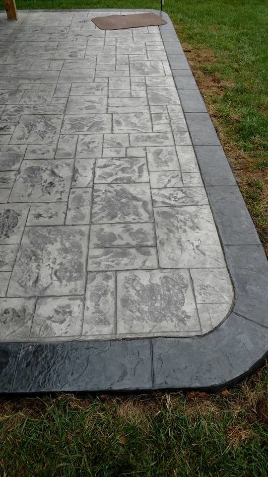 Inspiration for a medium sized traditional back patio in Other with a fire feature, stamped concrete and no cover.