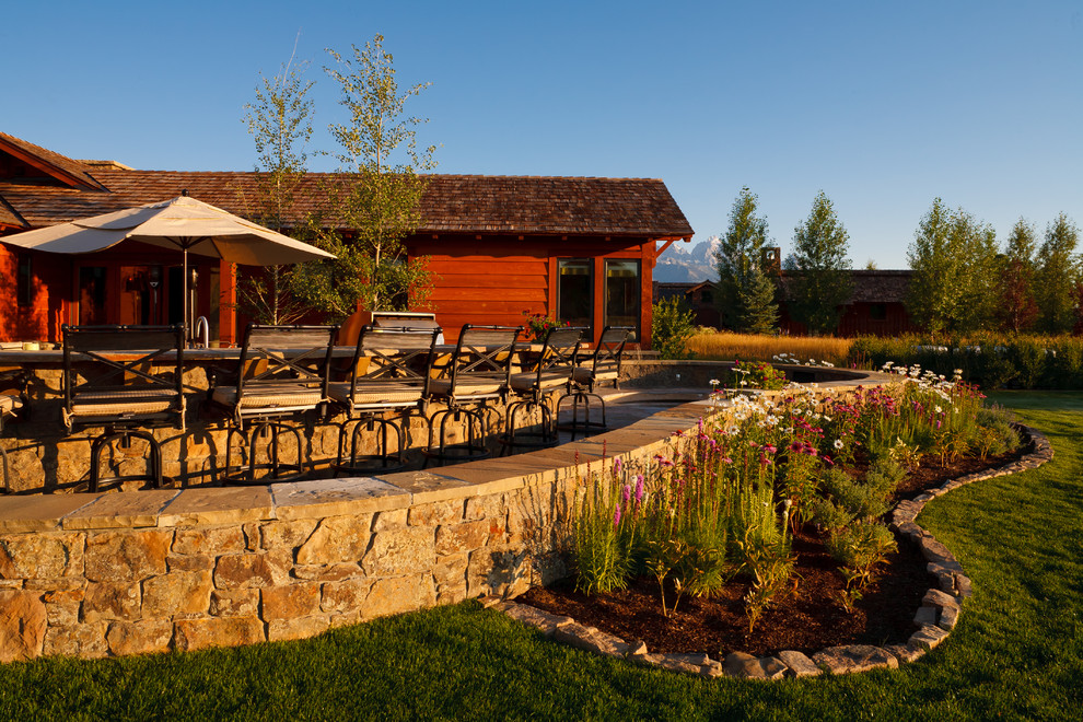 Design ideas for a rustic patio in Denver with no cover.