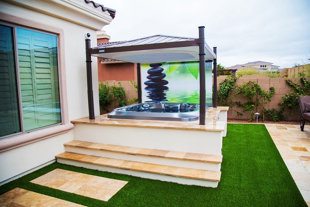 Patio fountain - large traditional backyard stamped concrete patio fountain idea in Phoenix with a pergola