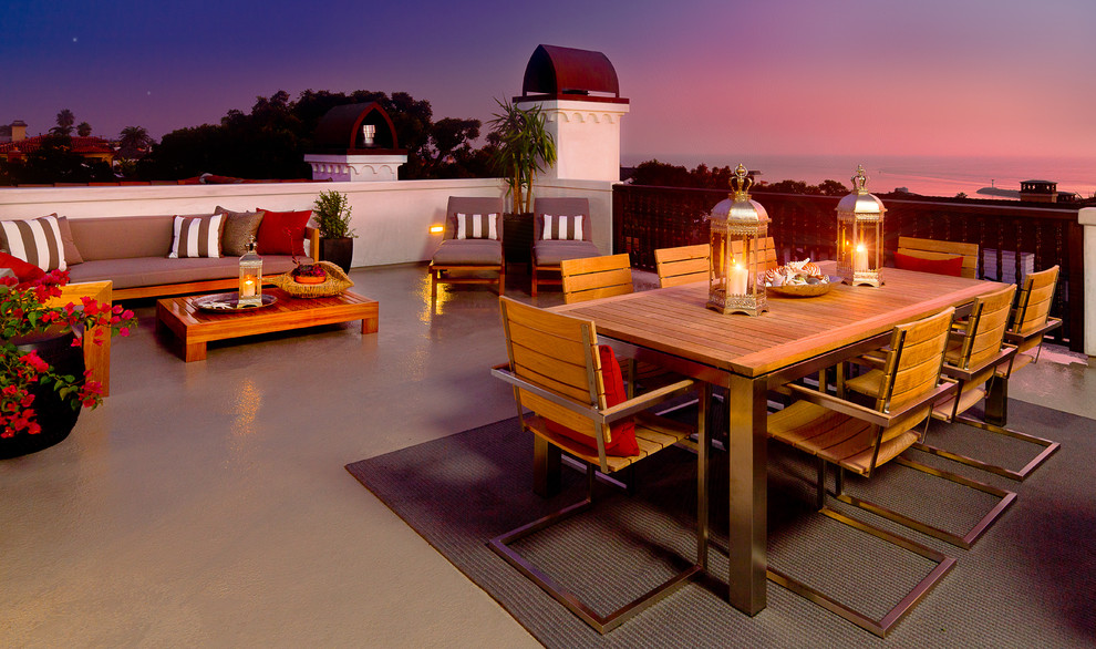 Design ideas for a large modern patio in Orange County with concrete slabs and no cover.