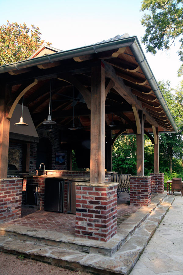 Patio kitchen - mid-sized traditional backyard brick patio kitchen idea in Orange County with a gazebo