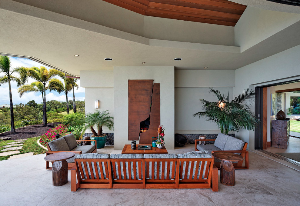 Inspiration for a world-inspired patio in Hawaii with a fire feature.