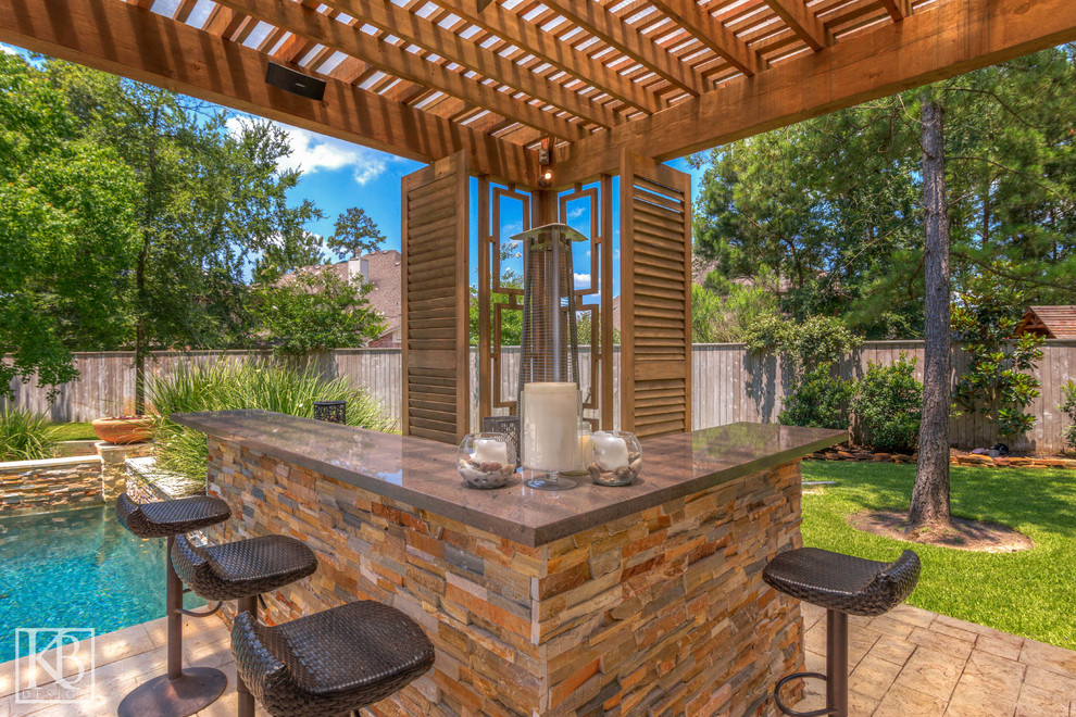 Inspiration for a backyard tile patio kitchen remodel in Houston with a gazebo