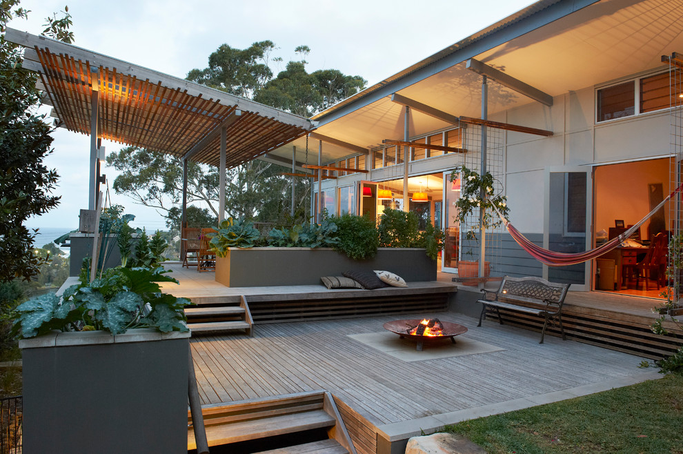 Inspiration for a contemporary patio remodel in Central Coast with a fire pit