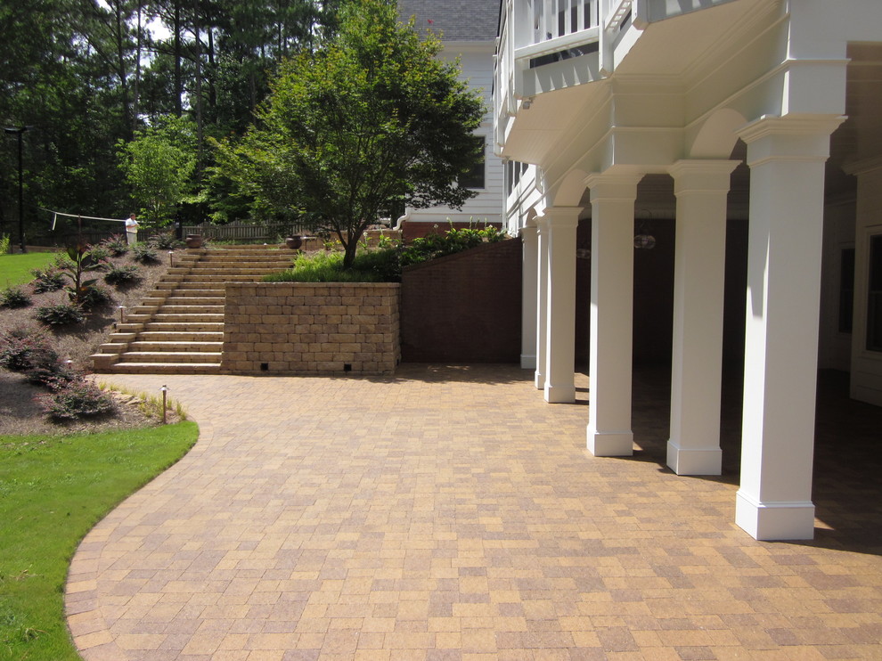 This is an example of a large classic back patio in Atlanta.
