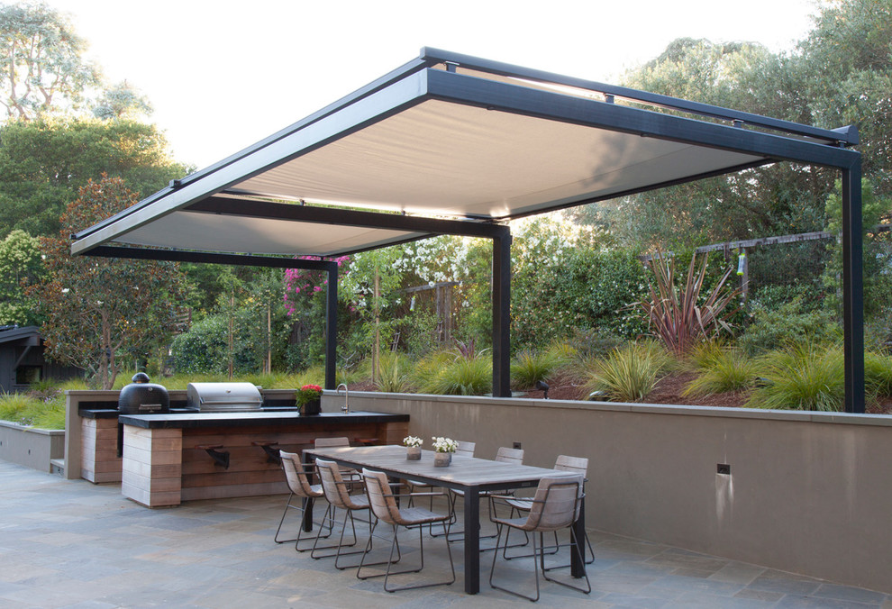 Inspiration for a transitional patio remodel in San Francisco with an awning