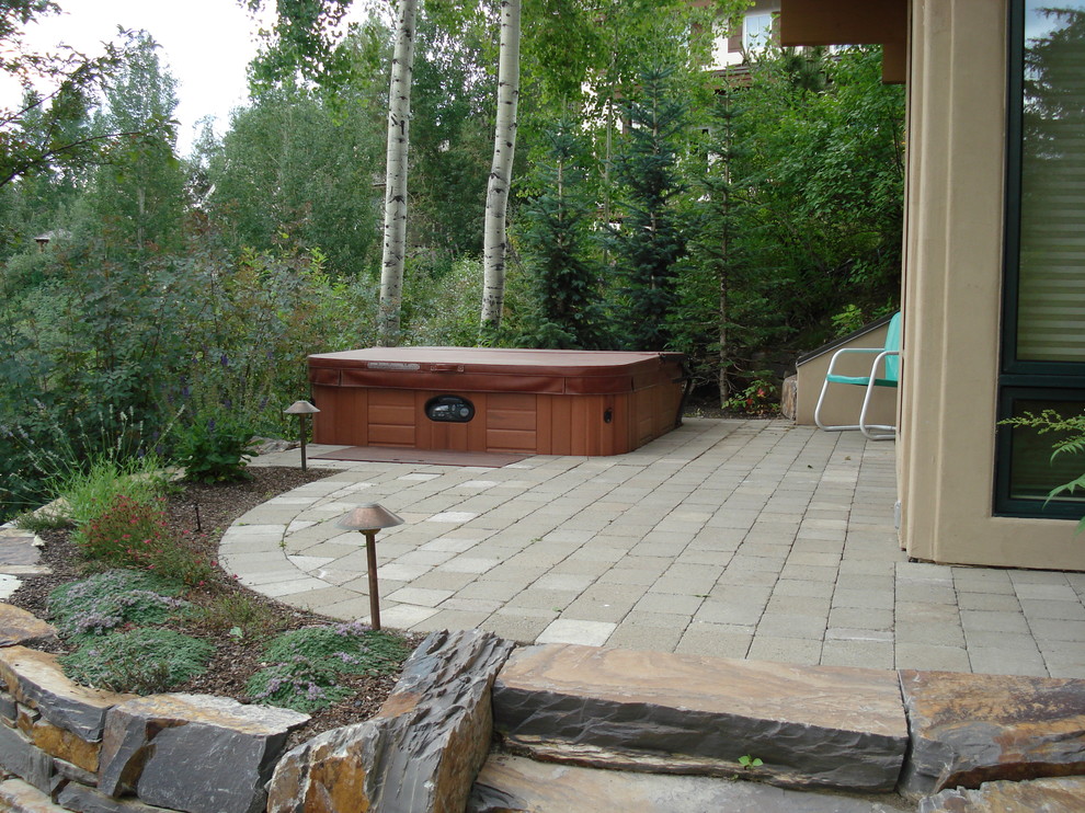 Small elegant backyard patio photo in Boise with decking and no cover