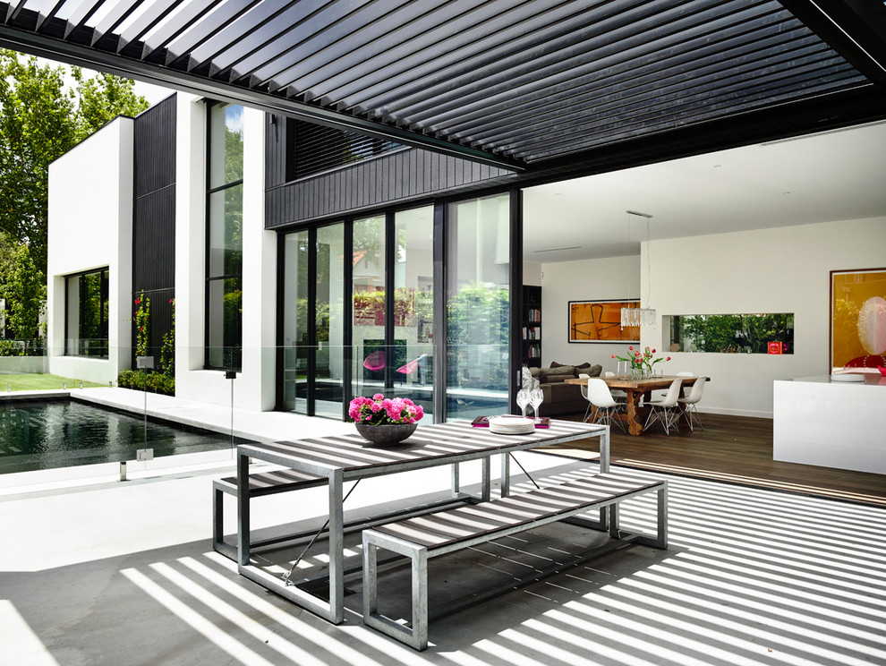 Design ideas for a contemporary patio in Melbourne with a pergola.