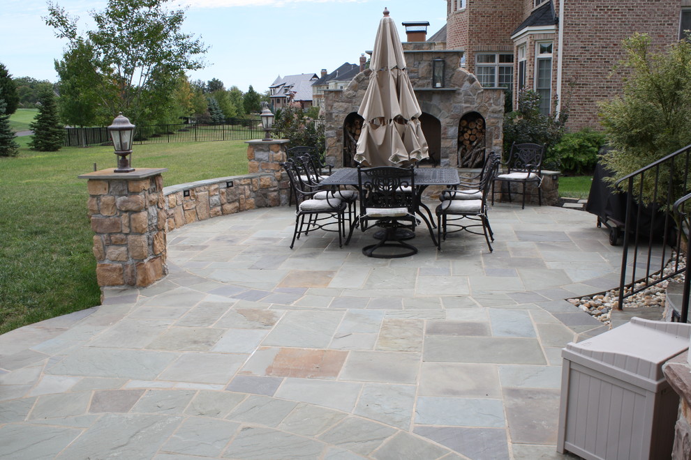 Kidney Shaped Flagstone Patio with Fireplace and Lights Patio DC