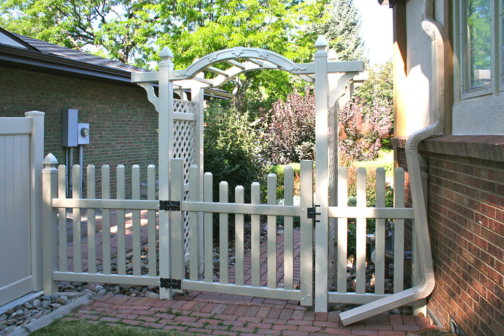 Photo of a medium sized traditional side patio in Denver with brick paving.