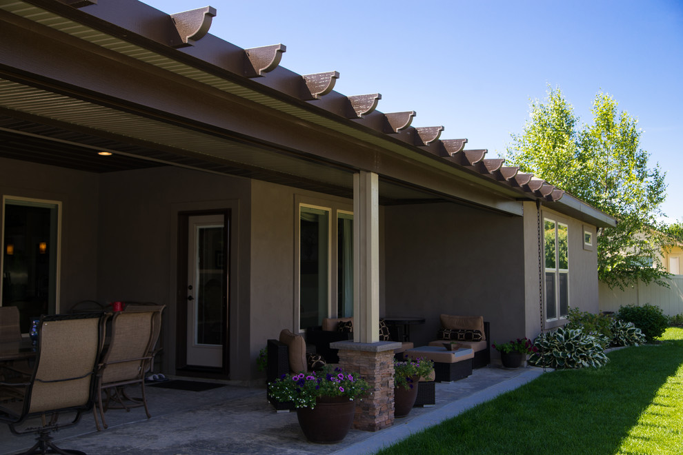 Example of a large tuscan patio design in Boise