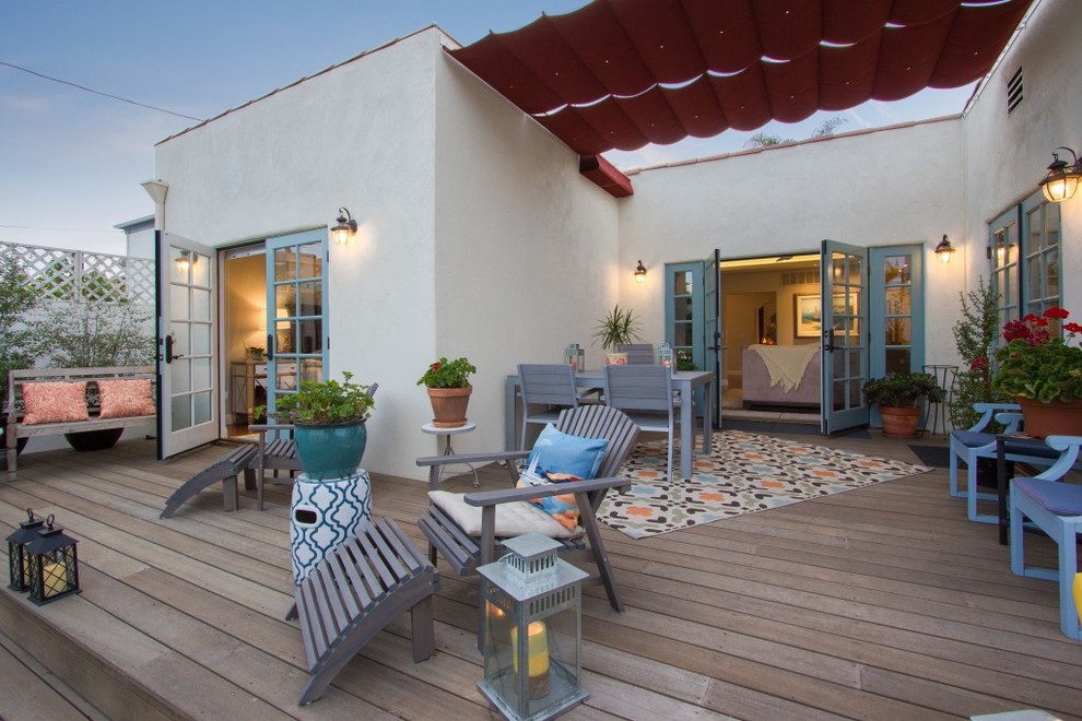 Medium sized mediterranean back terrace in Los Angeles with an awning.