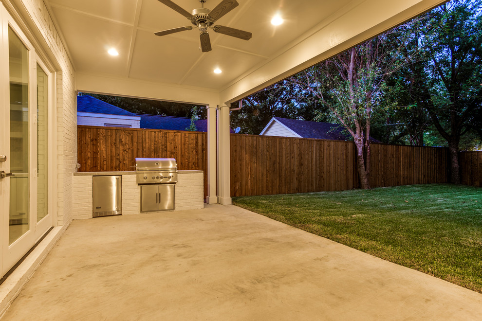 Mid-sized transitional backyard concrete patio kitchen photo in Dallas with a roof extension