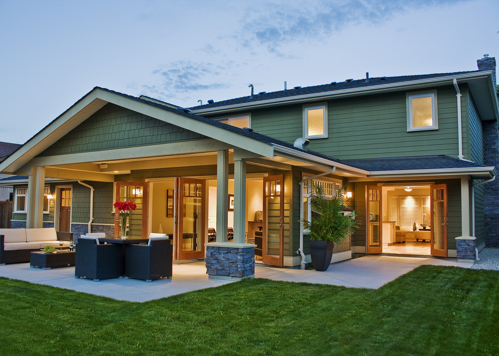 Example of a trendy patio design in Vancouver with a roof extension