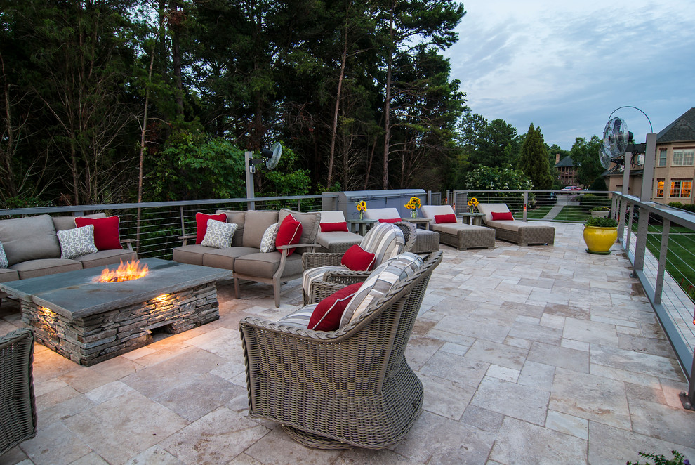 Patio - mid-sized coastal backyard stone patio idea in Charlotte with no cover