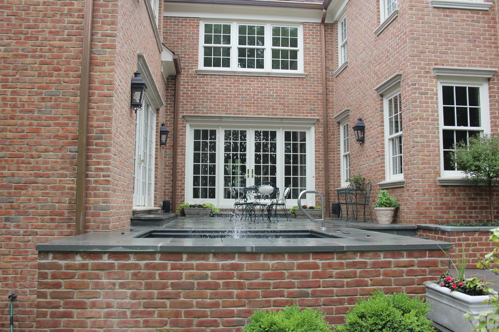 Lake Forest, IL Spa with brick walls and stone patio Traditional