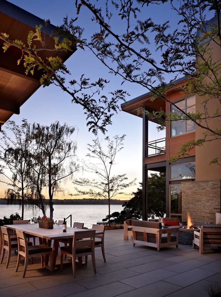 Design ideas for a contemporary patio in Seattle with a fire feature.