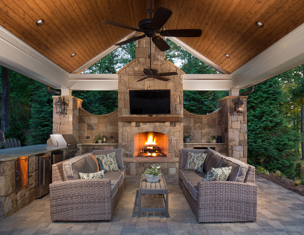 Design ideas for a large traditional back patio in Atlanta with concrete paving, an outdoor kitchen and a gazebo.