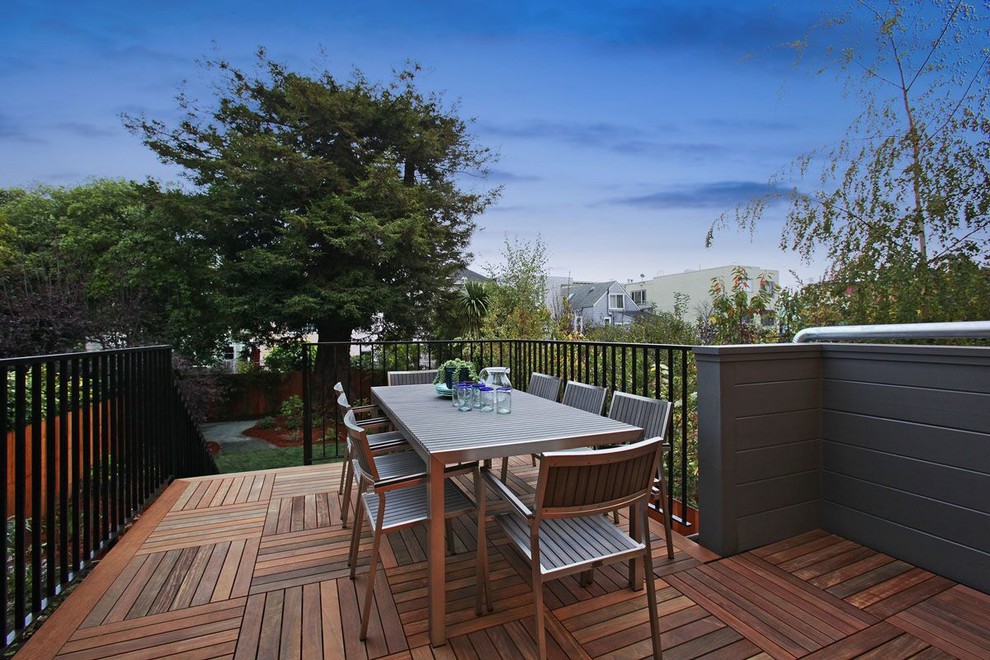 Photo of a large modern back patio in San Francisco with no cover, an outdoor kitchen and decking.