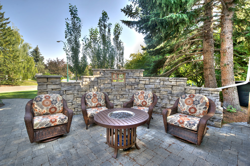 Patio - small traditional front yard patio idea in Calgary with no cover