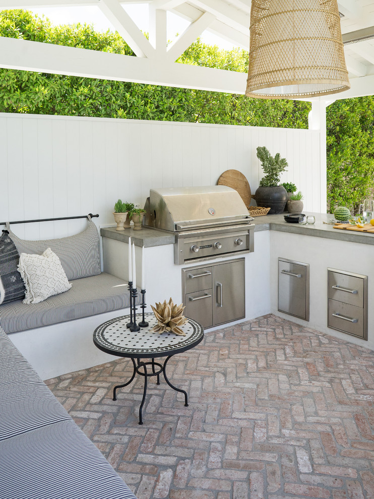 Inspiration for a coastal back patio in Orange County with brick paving, a gazebo and a bbq area.