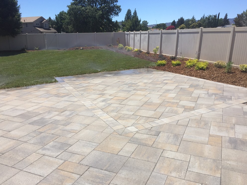Inspiration for a mid-sized timeless backyard tile patio remodel in Sacramento